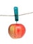 Apple on clothes peg