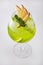Apple Cocktail In a luxuriously shaped glass consisting of ice and sliced apples, decorated with green herbs Filmed on a white sce