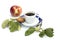 Apple, cookies, leaves and cup of coffee on a saucer with a blue