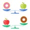 Apple and a donut on a scales. Healthcare concept.