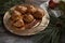 Apple Dumplings on Gold Plate with Greenery on Rustic Wood