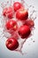 The apple fell into the splashing water. Photos on the black background