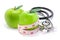 Apple fruits with measuring tape and medical stethoscope