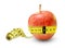 An apple full of strength and health measures its waist and is quite the result..Symbol of proper nutrition.