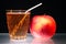 Apple and glass of juice on glass diet symbol