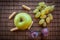 Apple green grapes green plum and rusk