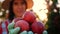 apple harvest. close-up. Female farmer holds in hands some red, freshly picked, ripe apples, on backdrop of orchard, in