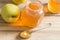 Apple jelly jam on wooden table with apples - selective focus on