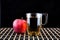 Apple juice and a box of red apples. Black background