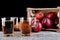 Apple juice and a box of red apples. Black background