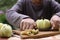 Apple knife cutter with cut slices core and whole apples close up photo