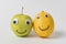 Apple and lemon with funny faces Googly eyes and smiles. Concept of true friendship