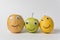 Apple, lemon and potatoes with Googly eyes and smiles. Food with funny face. Friendship and tolerance concept