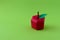 Apple made from paper on green background. Fresh fruits. Minimal, creative, vegan, healthy or food art concept. Copy space