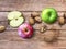 Apple and Nuts Background. Dried walnuts with aple on a wooden background.