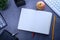 Apple , open diary, books and stationary on wooden background
