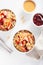 Apple peanut butter quinoa bowl with jam and cashew for healthy breakfast