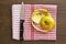 Apple peel with knife on red gingham towel