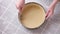 Apple pie cake preparation series - woman making holes in rolled dough in baking dish