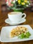 Apple pie and cappuccino on a wooden table