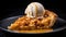 Apple pie with caramel topped with a scoop of vanilla ice cream