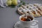 Apple pie with white towel on grey background. Dessert. Homemade cake with black tea and sieve. Autumn flatlay. Autumn homemade pi