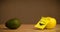 Apple with post-it note laughing on avocado