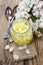 Apple preserve in glass jar standing on wooden table