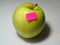 Apple and price sticker. One green apple