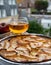 Apple products of Normandy, homemade baked apple cake and cider drink and houses of Etretat village on background, Normandy,