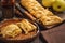 Apple puff pastry braid, on dark background.