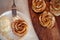 Apple roses, apple buns, serving with whipped cream and almond petals,