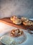 Apple roses, apple buns, serving with whipped cream and almond petals,