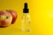 Apple-scented oil. Cosmetic serum with apple extract