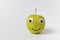 Apple smiley on white background. Apple with Googly eyes and drawn smile