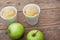 Apple sorbet and apples on wooden table