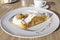 Apple strudel with vanilla ice cream, sauce and whipped cream