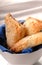 Apple turnovers in a white bowl