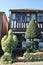 Appledore, Kent, United Kingdom - March 6, 2020: Historic timbered cottage with topiary shrubs