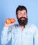 Apples antioxidant compounds responsible health benefits. Nutritional choice. Man with beard hipster hold apple fruit in