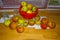 Apples from an apple tree on a wooden kitchen counter along a window in autumn