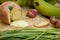 Apples, bananas, green, knife, texture, wood floors.