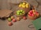 Apples in baskets and craft packages with paper bags on burlap for sorting apples