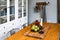 Apples and candles a wooden table. kitchen in a Scandinavian style