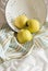 Apples in a colander on a striped towel