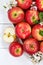 Apples fruits red apple fruit box on wooden board portrait format with leaves and blossoms