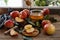 Apples with honey, leaves on the wooden table