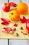 Apples, leaves and golden acorn squash on wood table