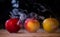 Apples like magic in the smoke fresh apples on the table on a dark background filled with magic smoke