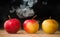 Apples like magic in the smoke fresh apples on the table on a dark background filled with magic smoke